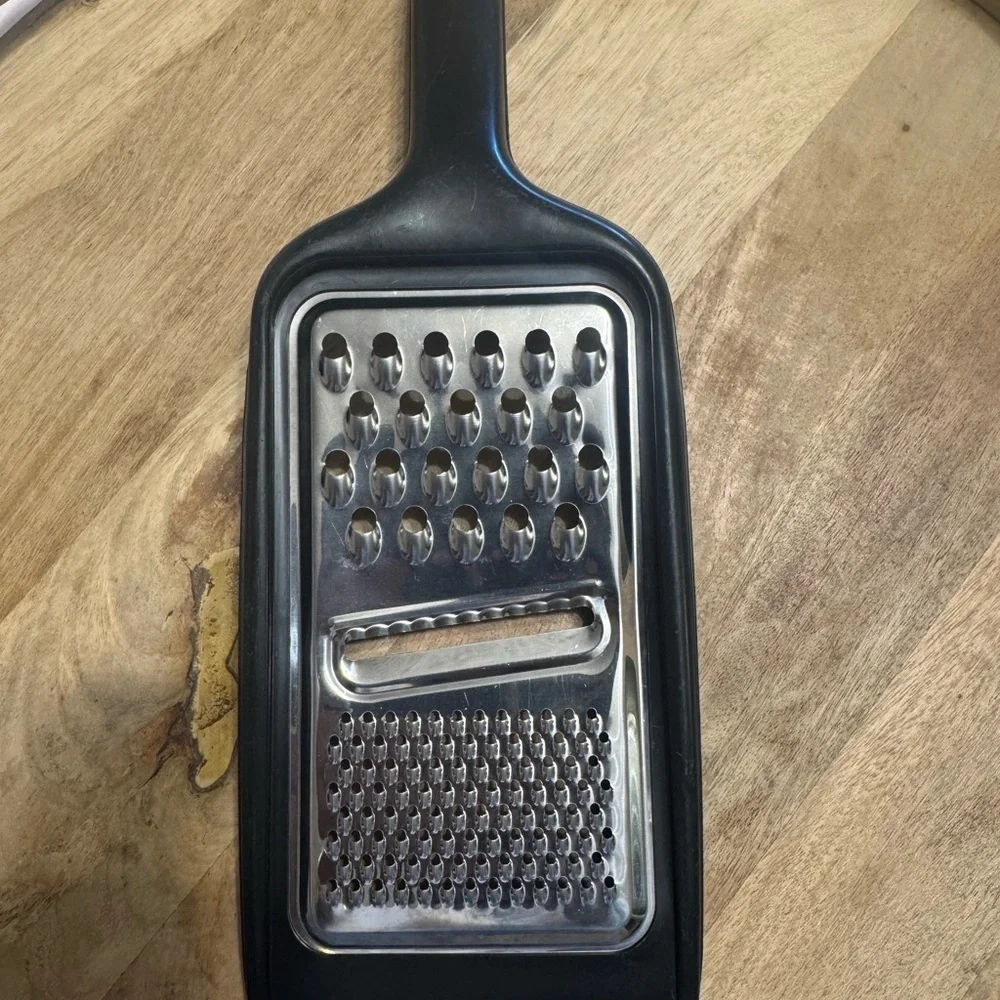 Sleek Black and Silver Handheld Grater